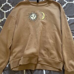 Brown sun and moon sweater